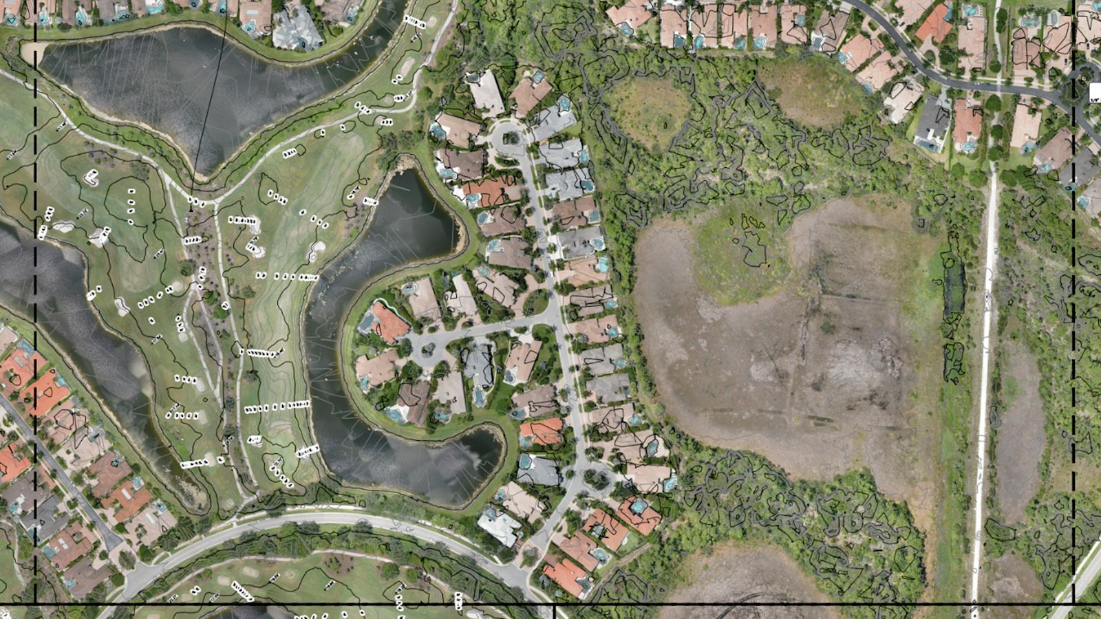 Aerial image of homes, ponds, and open land with survey mapping and contour lines